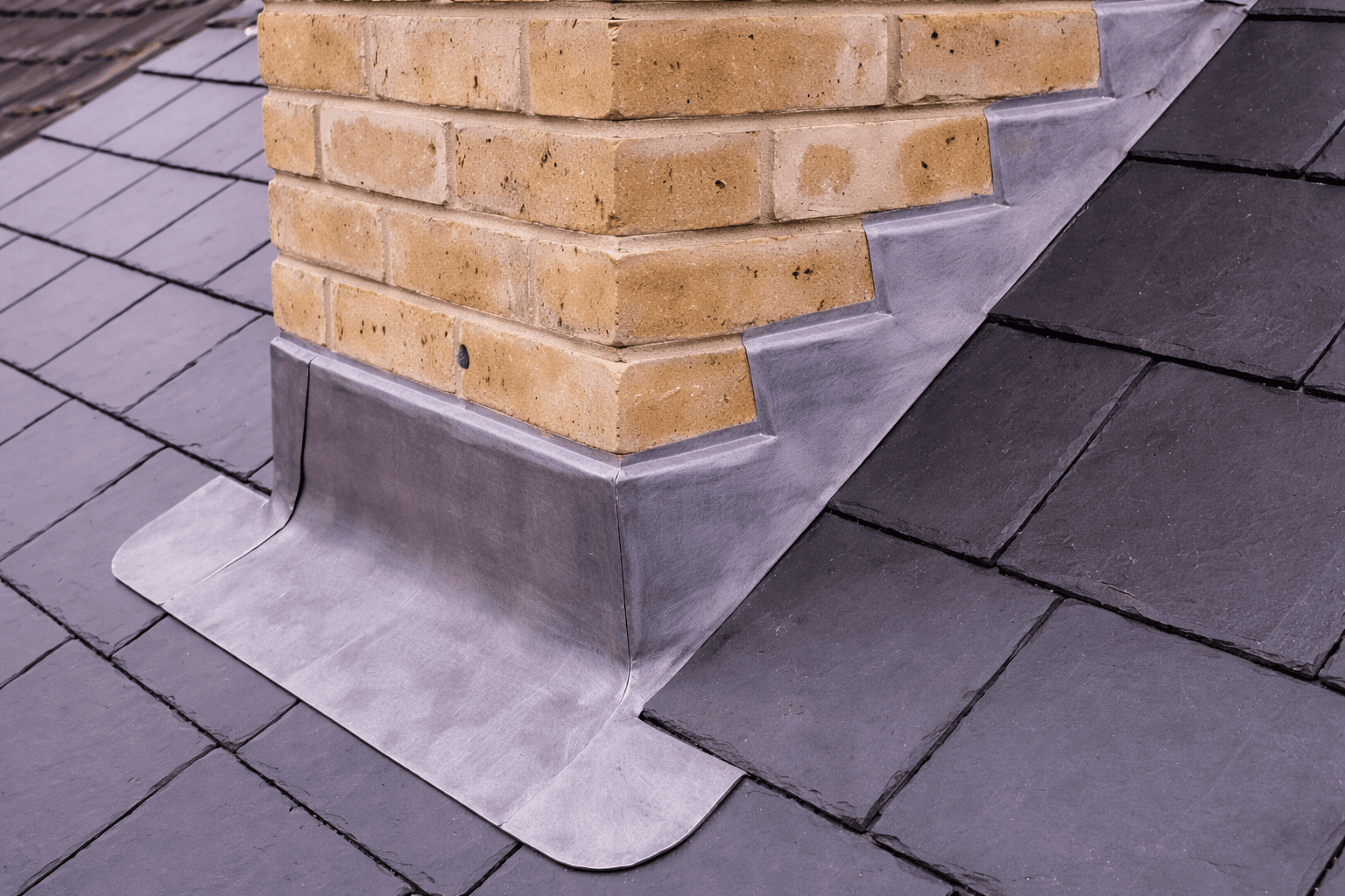 Roof and chimney leadwork repair with new lead flashing installed on residential property in Stoke-on-Trent